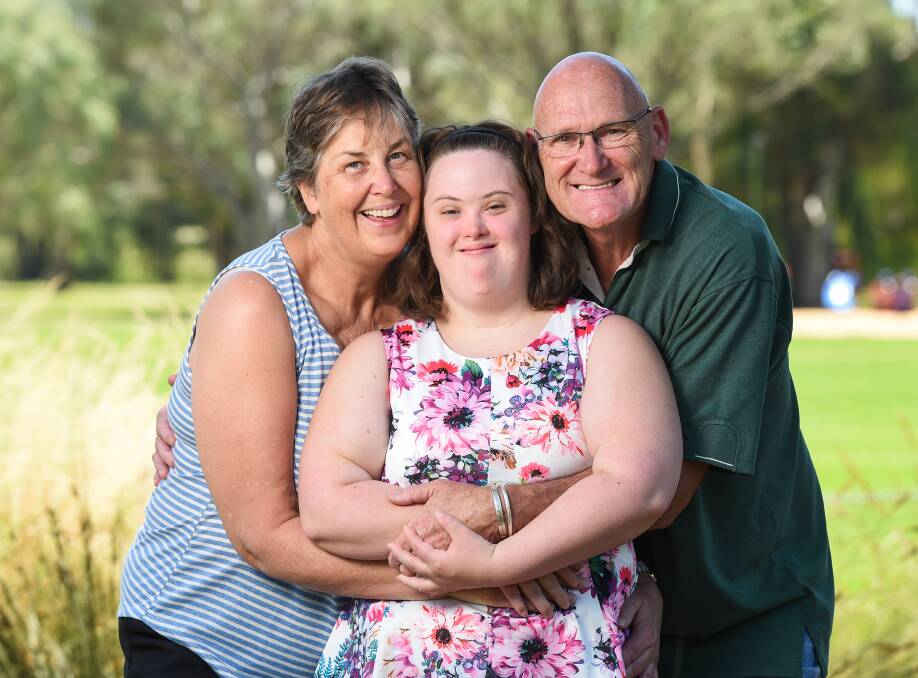 WILLING AND ABLE: Alannah McKeown, with proud parents Judith and Alan, is a joint winner of Wodonga's Young Citizen of the Year award. Picture: MARK JESSER