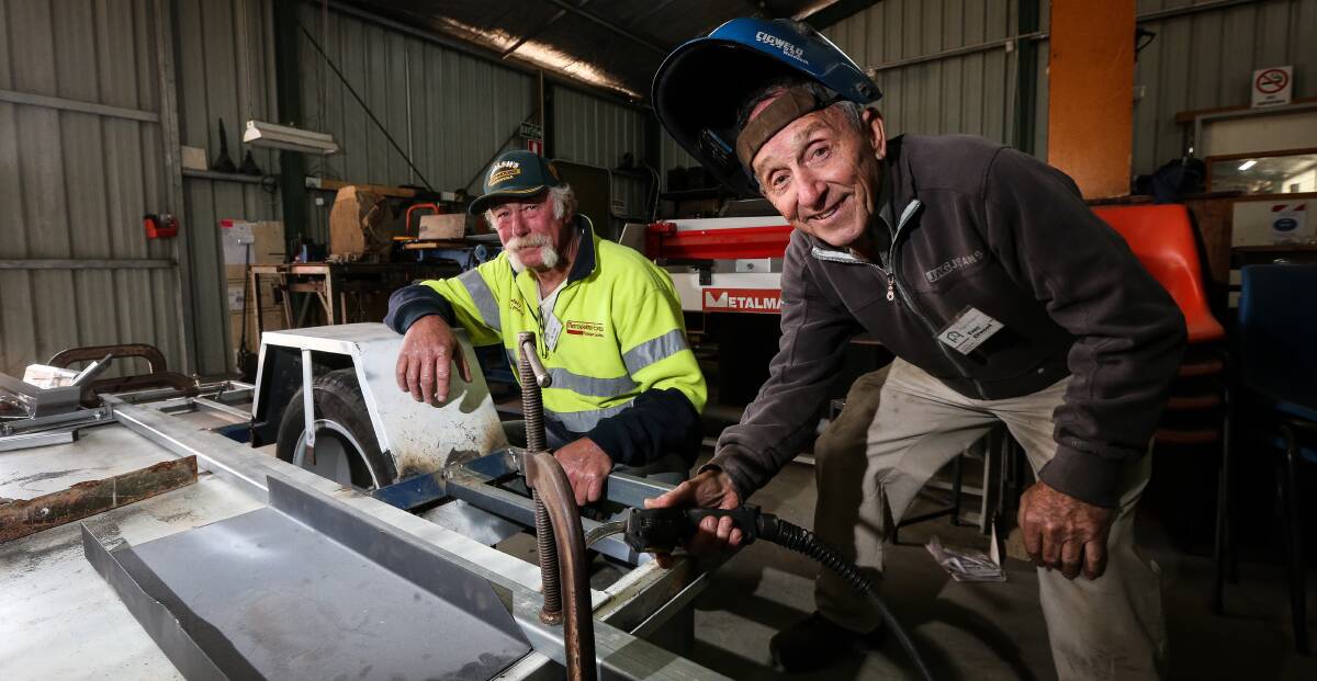 MEN OF MANY TALENTS: Thurgoona Men's Shed workshop manager Tim Young and Tony Ellwood are building a trailer to carry motorbikes.