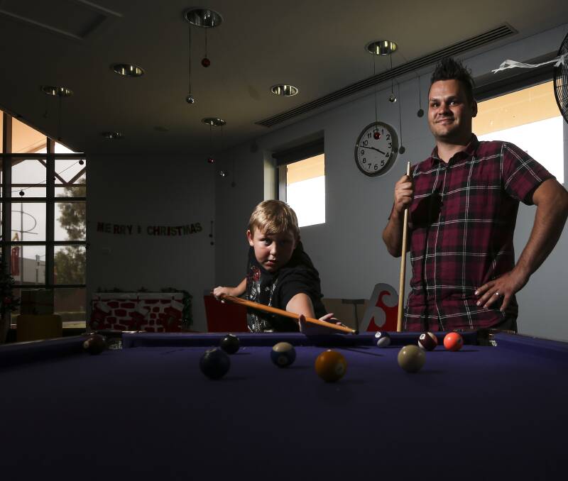 ARE YOU GAME?: Will Kendary, 12, takes on a game of pool against YES Youth & Family Services client service manager Jon Park at the new-look youth centre.