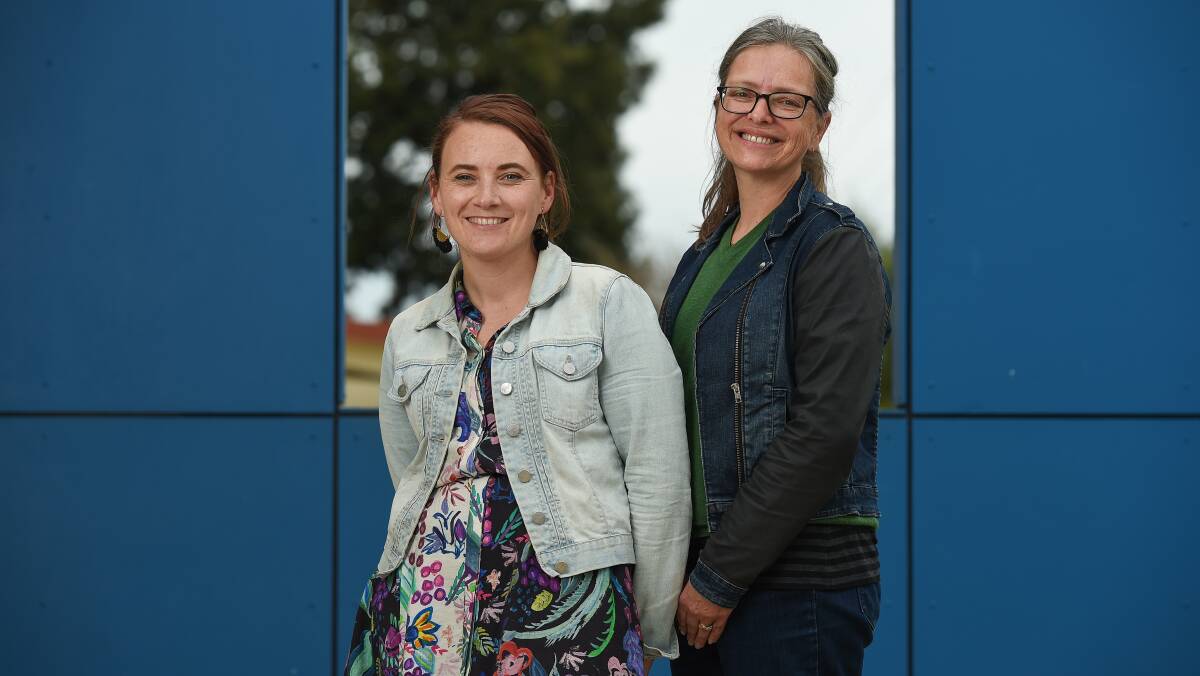 LITERACY LEADERS: St Augustine's Primary School learning diversity leader Luci Palmer with Sydney MSL therapist Kate Finnie. Picture: MARK JESSER