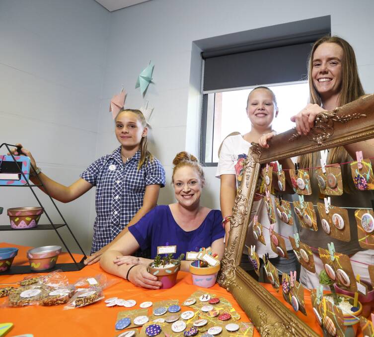 TALENT TIME: Lauryn Gale, 12, with Talent Links coach Kate Richie, Dakota Church-Parkinson, 11, and youth worker Emma Aldrich with items they made for the fundraising pop-up shop. Pictures: JAMES WILTSHIRE