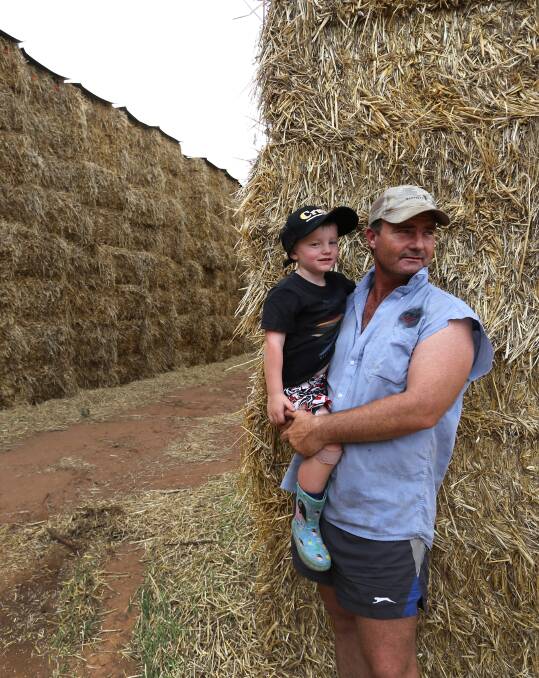 ROLLIN' OUT THE HELP: Burrumbuttock Hay Runners organiser Brendan Farrell, with son Sam in 2016, is preparing to deliver help again to drought-stricken farmers.