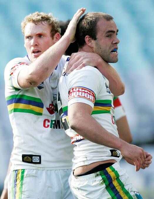 Joel Monaghan congratulates Adrian Purtell on scoring a try for Canberra Raiders in 2008.