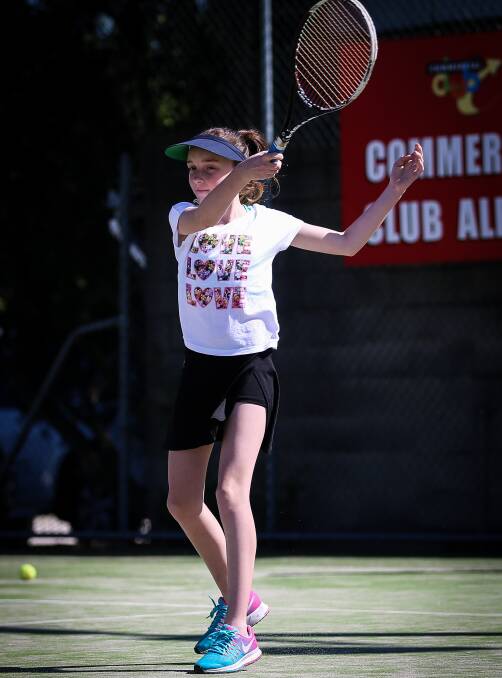 WHACK: Merissa Venturato plays a forehand during Saturday morning coaching. The action runs from 9.30am for players aged between seven and 14. Picture: JAMES WILTSHIRE