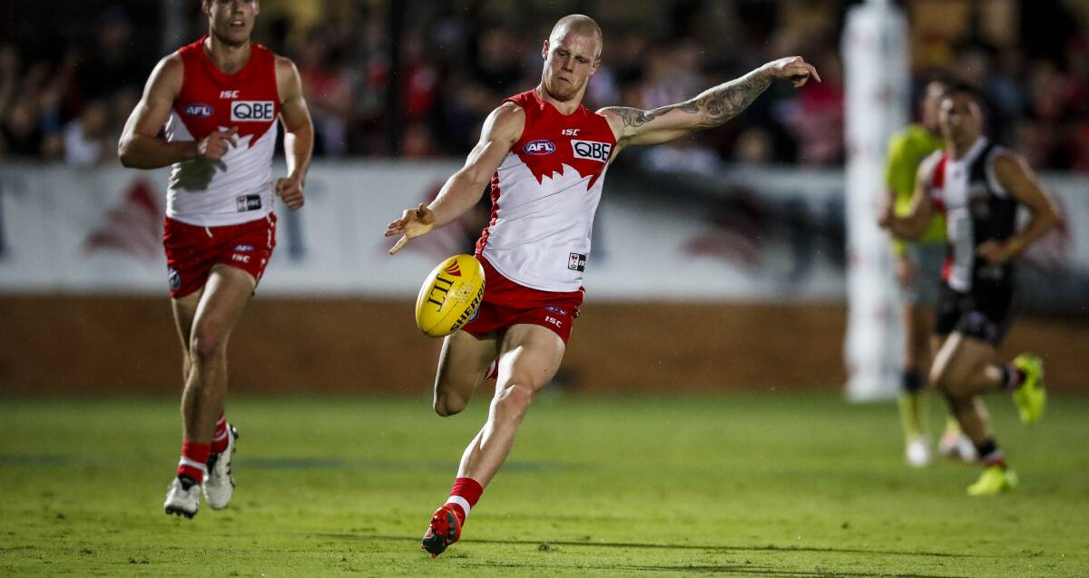 Zak Jones drives the Swans forward. He knocked up winning possessions in the midfield.