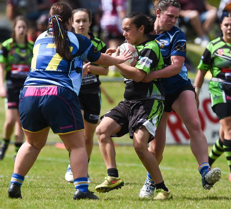 Pani Rupapere is stopped in her tracks by some strong defence at Greenfield Park on Saturday.