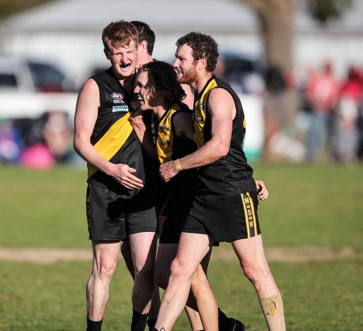 Osborne players celebrates their first Hume league premiership since 2012.