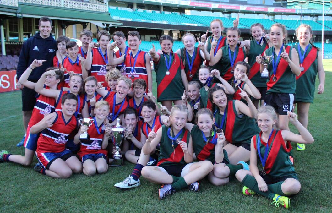 Trinity Anglican College and Lavington East Public players came together after posting impressive wins in the Paul Kelly Cup finals at the SCG on Monday.