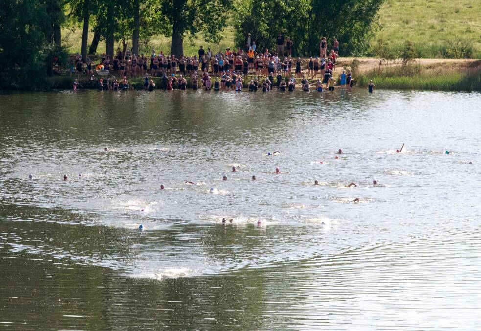 THE RACE IS ON: A big field powers its way through the swim leg at Allans Flat. Picture: SIMON BAYLISS