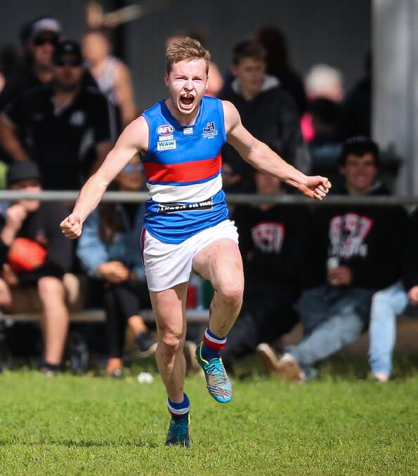 HAPPY CAMPER: Jindera's Sam Crawshaw celebrates a goal during the opening quarter of Saturday's win over Murray Magpies. Pictures: JAMES WILTSHIRE