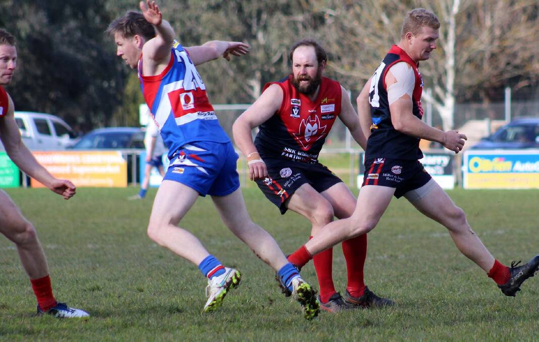 IRON MAN: Durable Corryong coach Evan Nicholas (centre) in action during their recent victory over Bullioh. Picture: DEB HARRAP