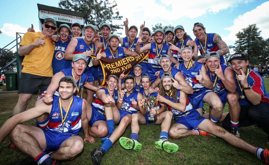 Jindera's reserves celebrate their thrilling seven-point win over Henty on Saturday. Bulldog Hunter Smith sealed the win with a goal in the last minute.