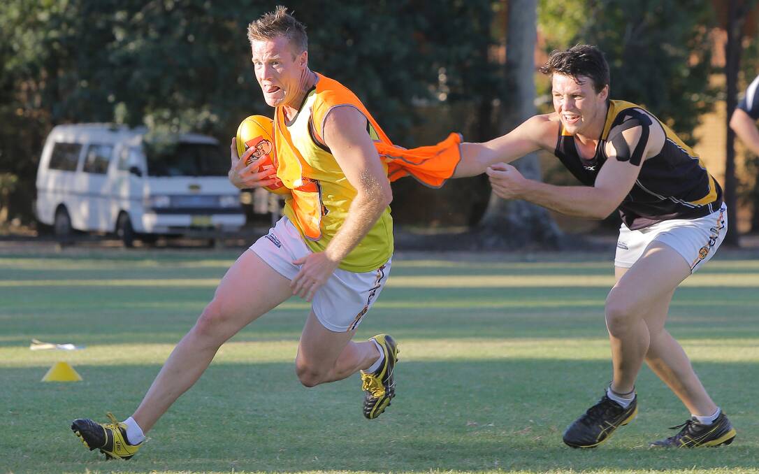 Giants' recruit Jeremy Duck tackles Josh Gaynor during pre-season training at Albury in 2014.