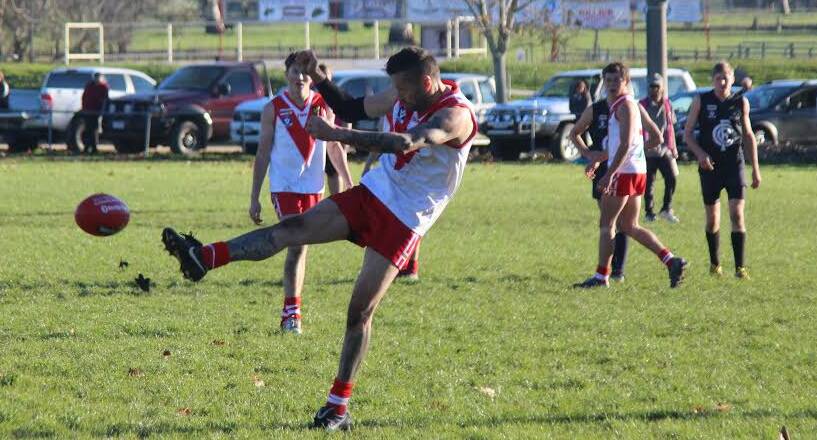 Former Carlton player Glenn Manton in action for Federal against Cudgewa. The Swans ran out comfortable victors.