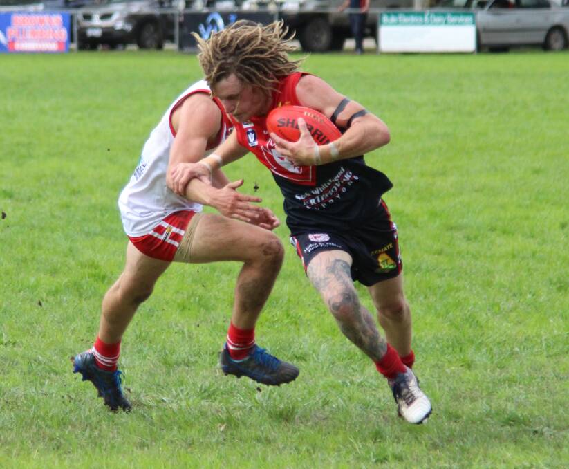 Corryong livewire forward Dave Low breaks clear against Federal in the Upper Murray league.