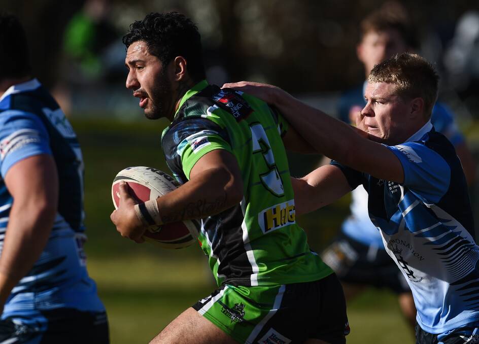 NOWHERE TO RUN: Albury Thunder's Ben Taylor in action against Tumut at Greenfield Park on Sunday. Pictures: MARK JESSER 