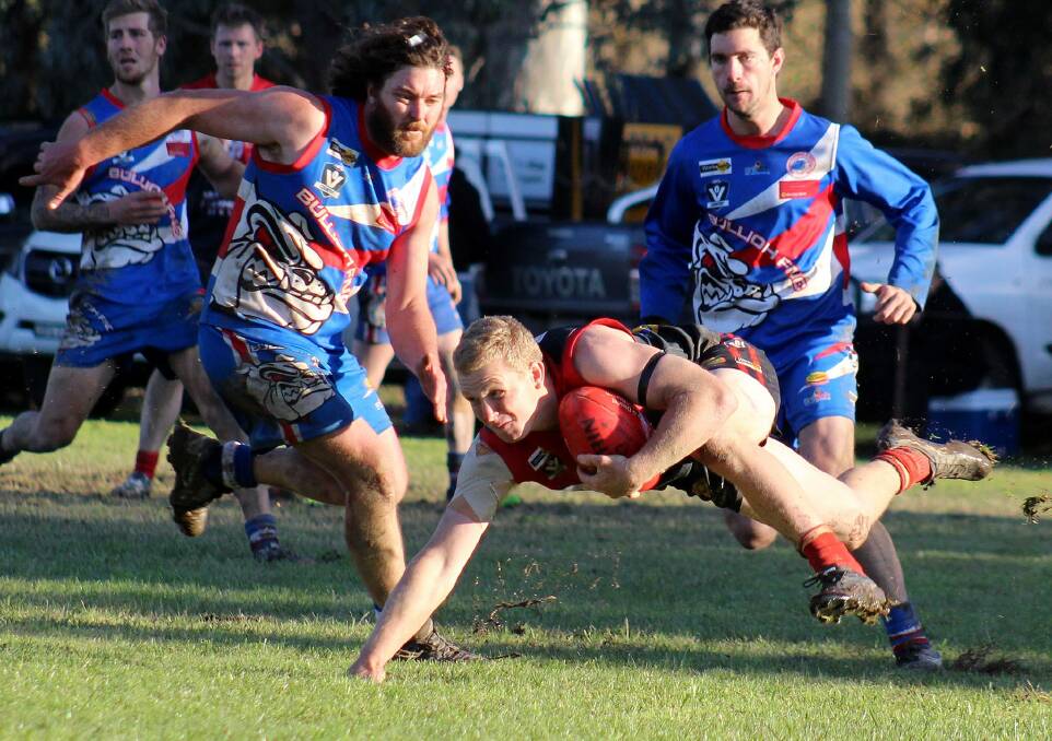 BALANCING ACT: Corryong's Jarrod Williams weaves his way out of trouble against Bullioh at Bullioh on Saturday. Pictures: DEB HARRAP