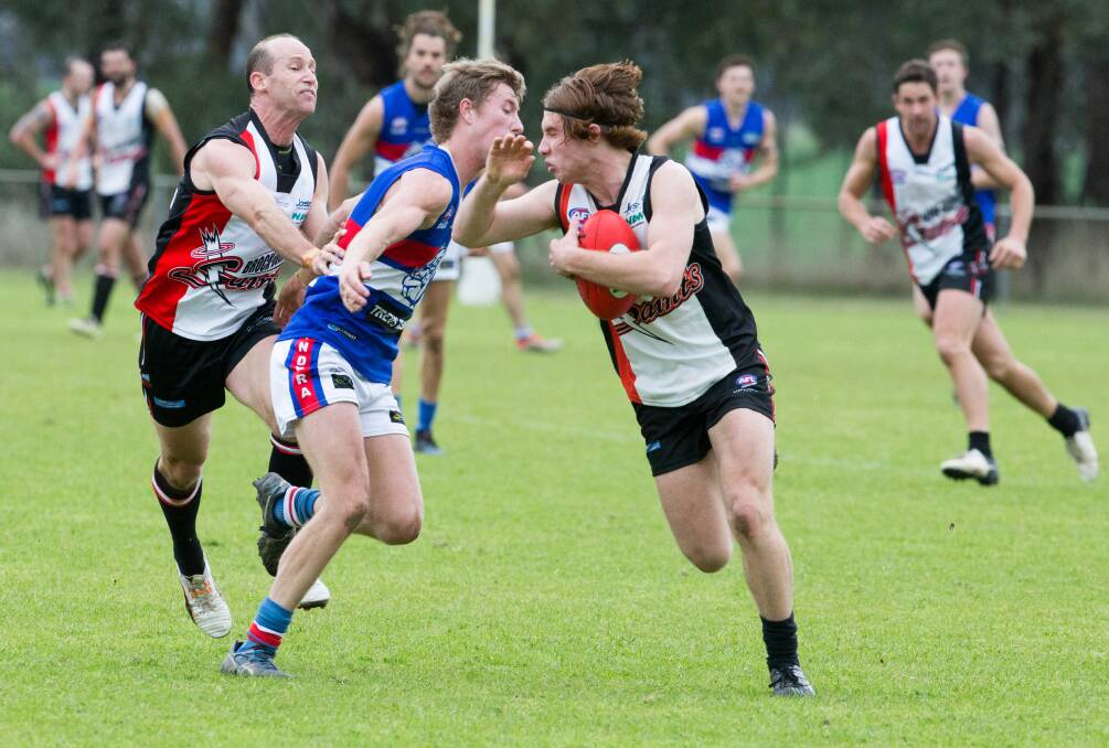 Brocklesby-Burrumbuttock youngster Josh Koschitzke attempts to break a tackle against Jindera on Saturday. The Bulldogs won by 19 points.