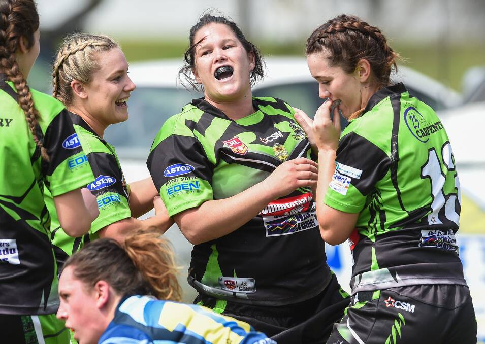 TRY TIME: Albury Thunder's Tenille Ballard celebrates with her teammates. Pictures: MARK JESSER