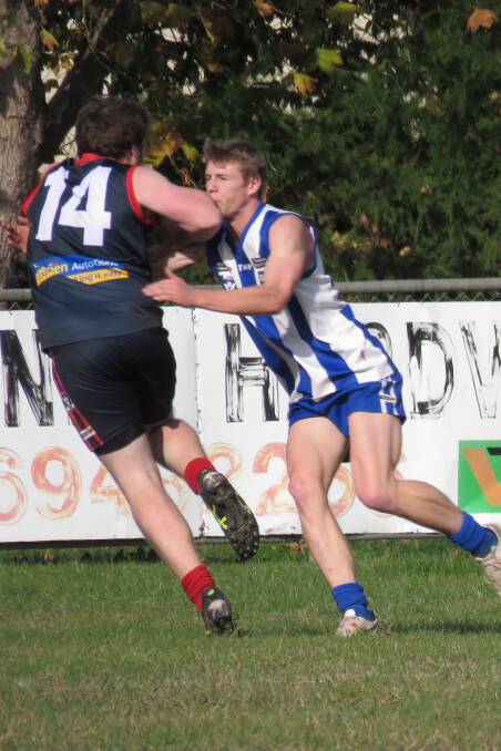 OUCH: Corryong's Jarrod Cass tangles with Roo Quinn Cooney in the Upper Murray league on Saturday. Pictures: WENDY LAVIS