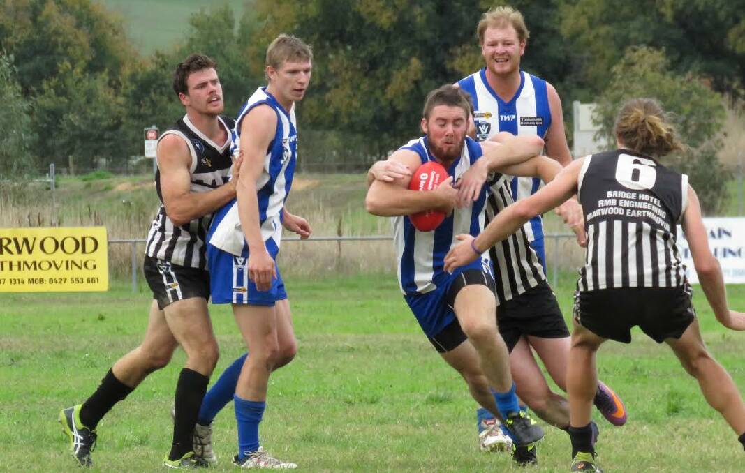 ON THE MOVE: Tumbarumba's Harry Grant tries to dodge his way out of trouble against Border-Walwa. Picture: WENDY LAVIS
