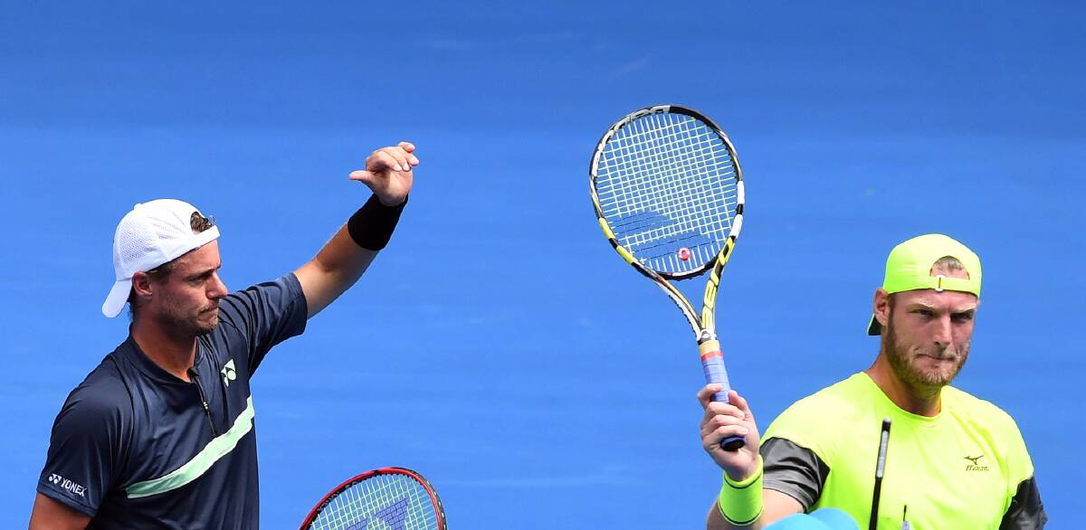 THUMBS UP: Lleyton Hewitt and Sam Groth are eager to go deep into the men's doubles draw in the Australian Open this week. They have reached the quarter-finals.