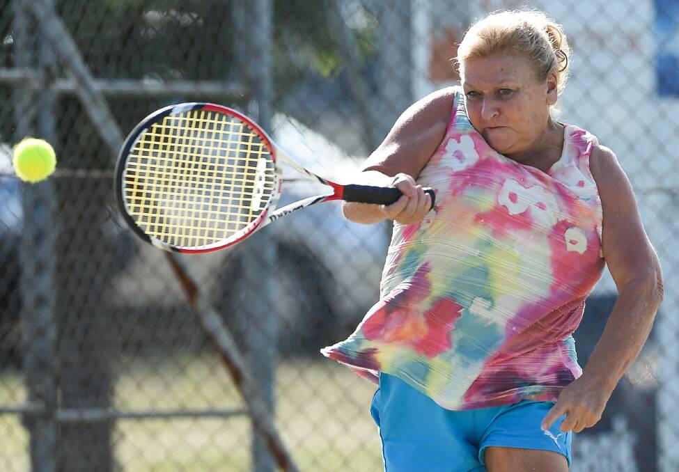 Table Top's Heather Bartel pounds a forehand during the women's action.