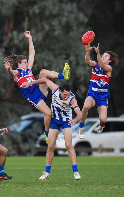 OUTNUMBERED: Thurgoona's Jake Gollan and Thomas Rake have Yackandandah's Arden Greiner covered on Saturday. Pictures: MARK JESSER