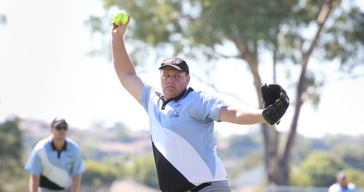 Brad Nicholson pitches for Softball Albury-Wodonga at Jelbart Park. Seventeen teams took part in the championships.
