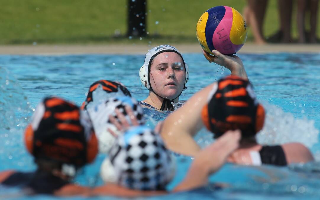 CIRCLING SHARKS: Phebe McLeod prepares to pass for Sharks against Albury Tigers in Ovens and Murray water polo on Sunday. Picture: KYLIE ESLER