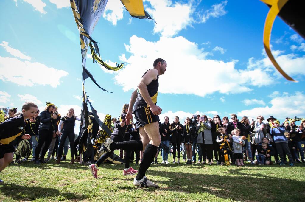 MAN OF THE MOMENT: Veteran Cat Hayden Gleeson runs on to the ground for Saturday's grand final against Jindera. Pictures: JAMES WILTSHIRE