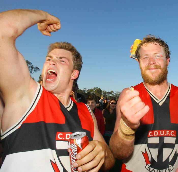 HAPPY DAYS: Key players Brad Talbot and Mark House celebrate after defeating Billabong Crows by 113 points in the 2007 grand final at Rennie.