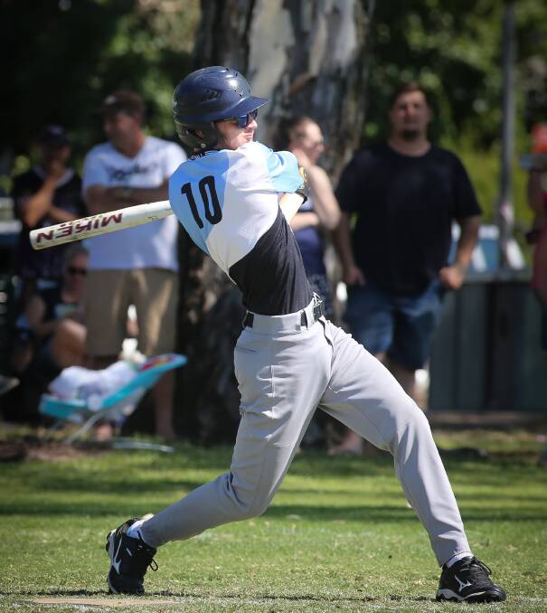 SMASH HIT: Dustin McDougall hits out for Softball Albury-Wodonga in the Victorian championships on Saturday. Picture: JAMES WILTSHIRE