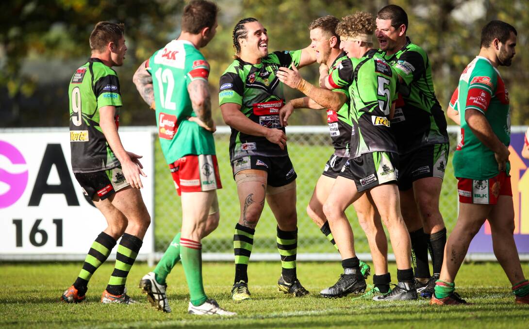 TIME TO CELEBRATE: Shannon Rupapare is first to congratulate Ben Jeffery on his spectacular try at Greenfield Park. Picture: JAMES WILTSHIRE