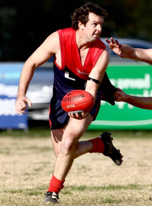 LOYAL AS THEY COME: Demon defender Josh Schirmer in action for the Demons in 2009. He will play his 300th match against Holbrook at Lockhart on Saturday.