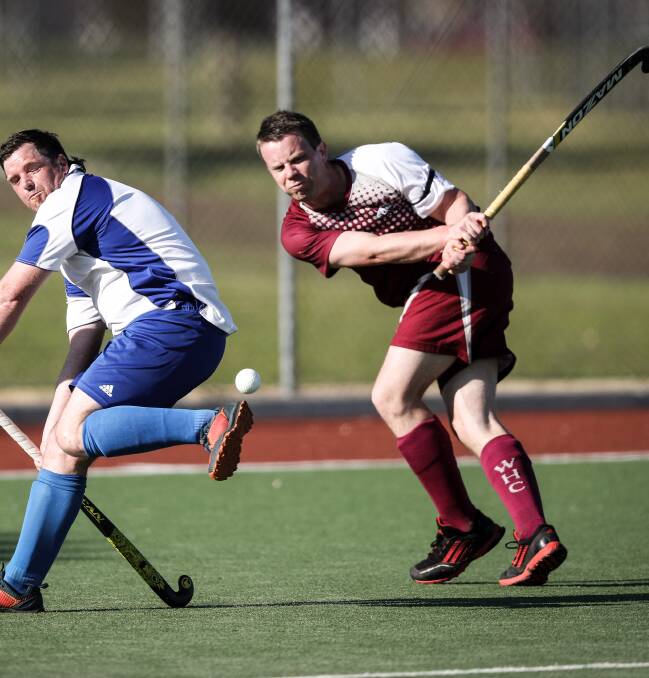 WHACK: Wodonga's Michael Darmody smashes his team into attack on Sunday. Pictures: JAMES WILTSHIRE