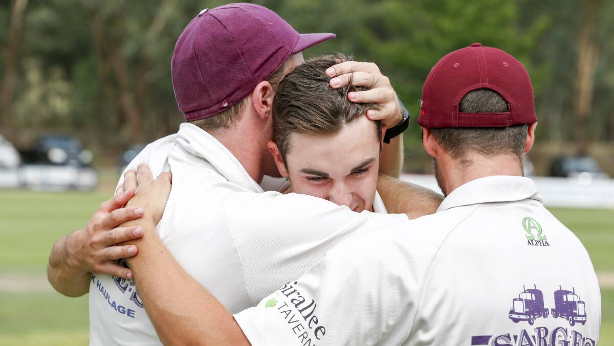 Avery Weilandt is swamped by his Wodonga teammates after winning last season's CAW provincial grand final against Lavington at Tallangatta.