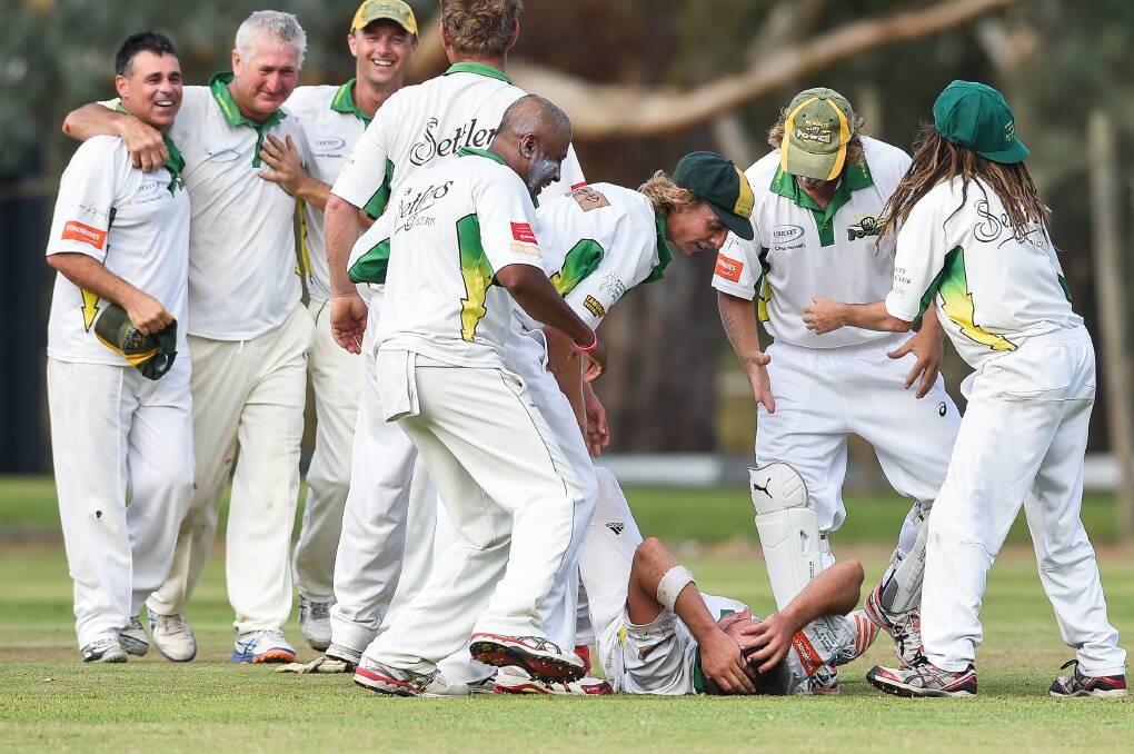 YOU LITTLE BEAUTY: Jubilant Mount Beauty players celebrate after taking the final wicket against Kiewa at Kiewa on Sunday. Pictures: MARK JESSER