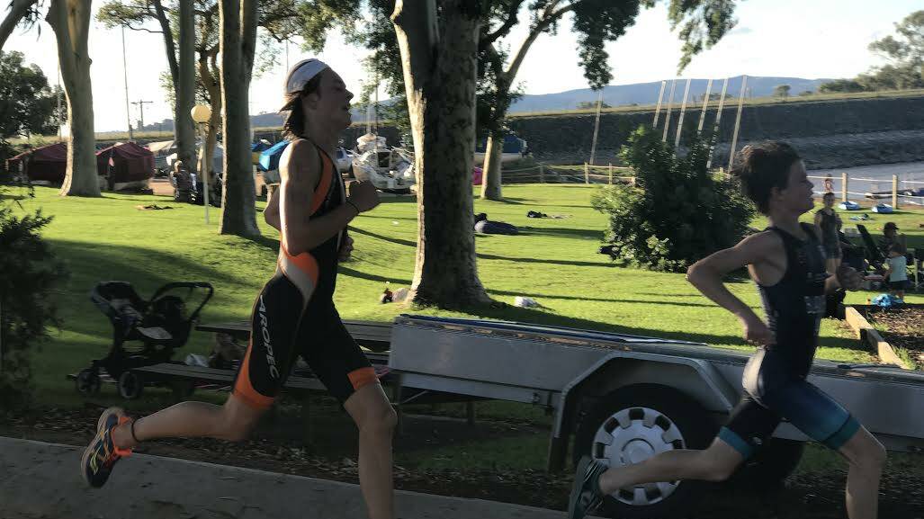 Lucas Bladwell, 13, and Jack Grigg, 16, go stride for stride in the Albury-Wodonga Triathlon Club's aquathon.