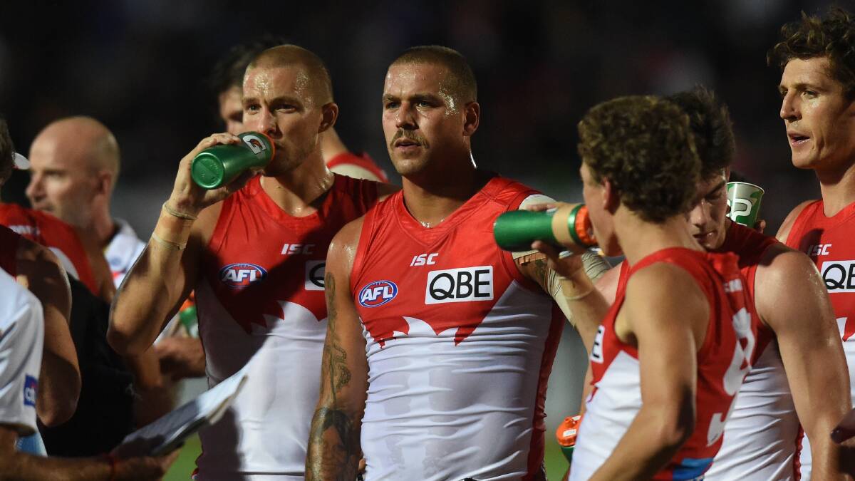 Key Swan forwards Sam Reid and Lance Franklin take a breather during the quarter-time break