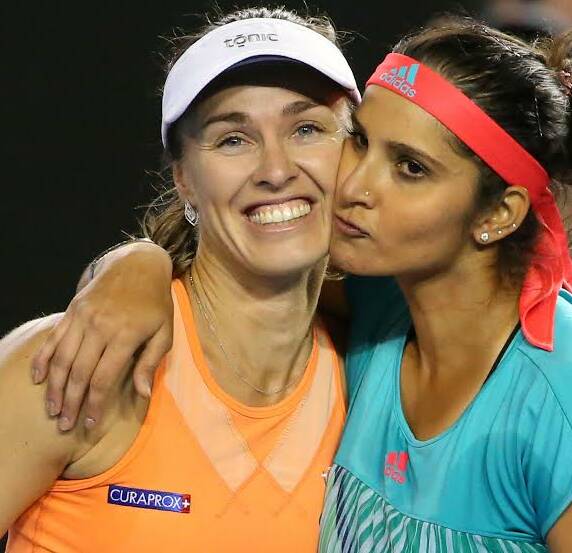 ON TOP OF THE WORLD: Martina Hingis and Sania Mirza after taking out the Australian Open in Melbourne. They will be chasing more success at Roland-Garros next month. Picture: GETTY IMAGES