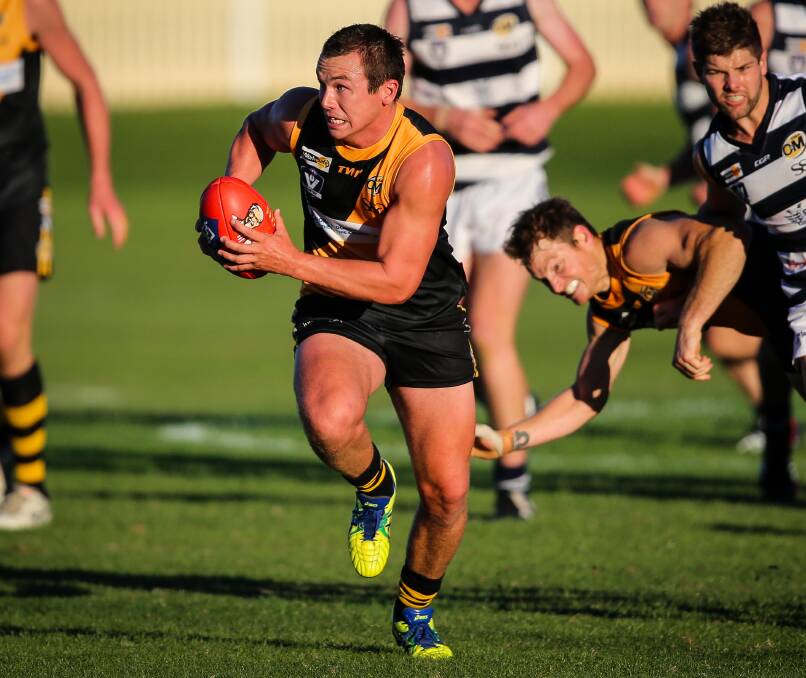 Tiger Alex Jones dashes clear of a pack during Albury's 71-point win at the Albury Sportsground.