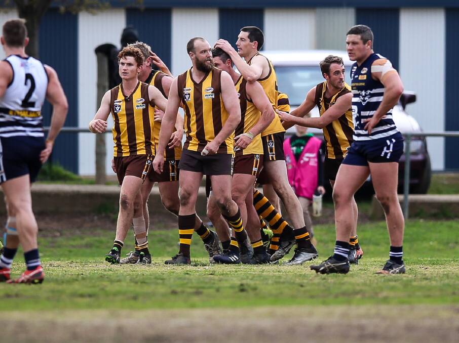 HAWK TALK: Kiewa-Sandy Creek celebrate Leigh Cameron's goal after the three-quarter-time siren. Pictures: JAMES WILTSHIRE