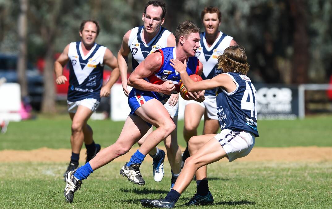 OUTNUMBERED: Thurgoona recruit Connor Meredith had his hands full against Mitta United on Saturday. Picture: MARK JESSER