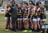 THREE IN A ROW: Murray Bushrangers coach Mark Brown talks tactics with his side during Saturday's clash against Bendigo. Picture: STEPHEN HICKS