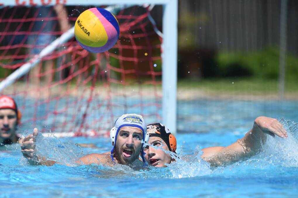 PUTTING THEIR HEADS TOGETHER: Northside's Trent Remington and Albury Tigers' Harry Duck do battle at Albury Swim Centre on Sunday. Picture: MARK JESSER