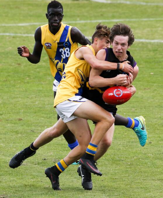 CAUGHT: Murray Bushranger Ryan Bruce tries to bust a tackle against Western Jets at Norm Minns Oval on Saturday. Pictures: SIMON BAYLISS