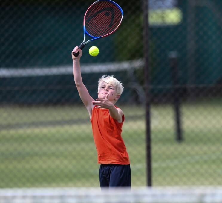 SERVING IT UP: Albury youngster Ryan Tinworth in action during the eight and under competition at Albury. Picture: JAMES WILTSHIRE