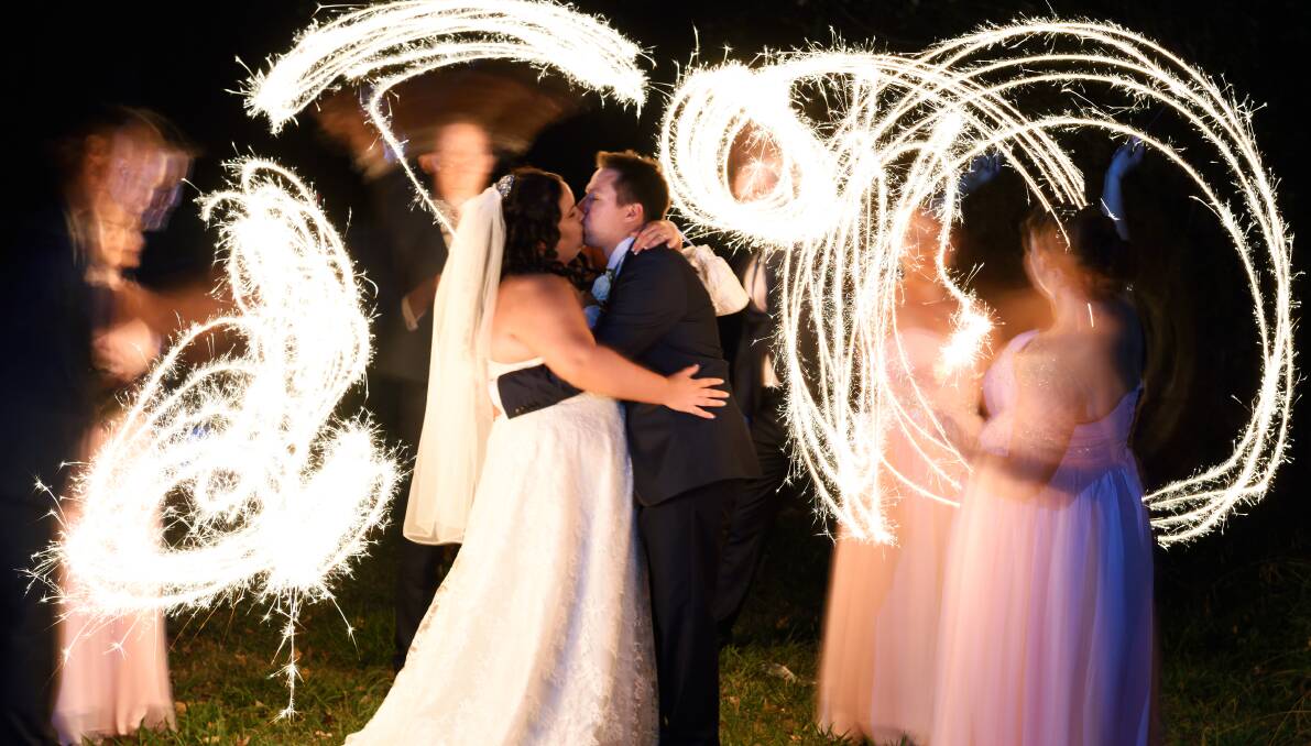 LIGHTS OF LOVE: Cassandra Thies married Mitchell Hulme on April 16 in front of family and friends. Picture: A BEAUTIFUL EYE PHOTOGRAPHY