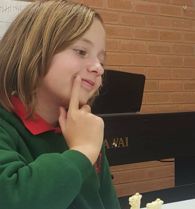 Leah Grady,  Year 5 from Lavington East Public School considers her next brilliant move at the chess competition. Picture: JODIE MURRAY